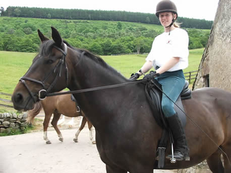 Student sitting on horse